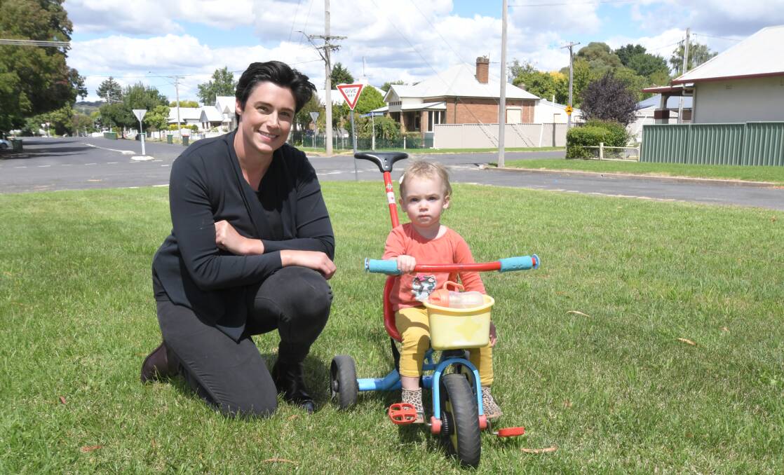 PLAY SPACE: Emily Thorburn with daughter Ellie has started a petition calling for more children's playgrounds and a community garden. Photo: JUDE KEOGH