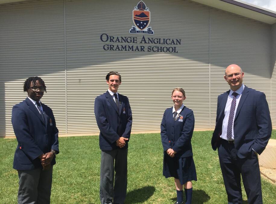 PREPARED: Orange Anglican Grammar School HSC students Timothy Phiri, Thomas Dale, Charlie Watson and Reverend Louis Stringer.