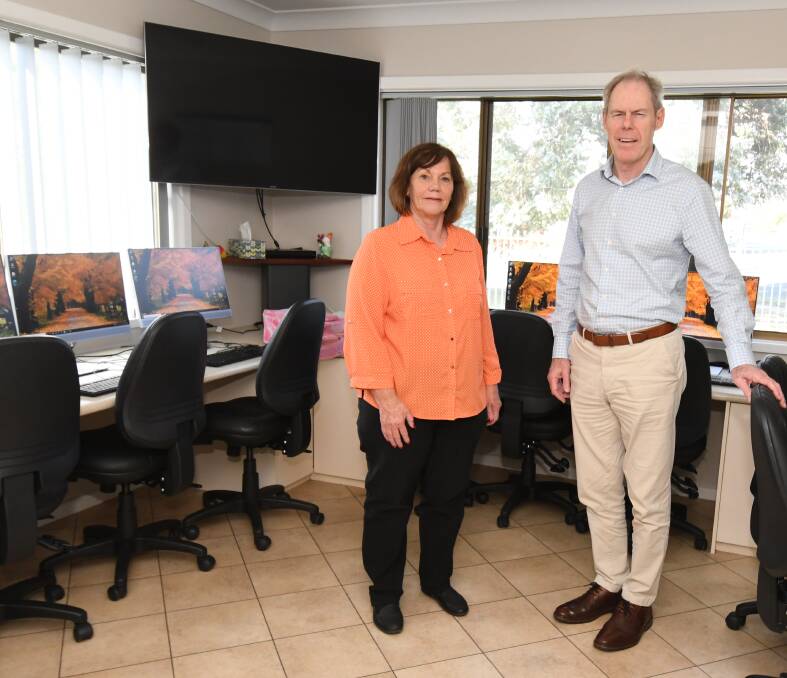 RECOGNITION: Bowen Residents Action Group manager Paula Townsend and Australian Charities and Not-For Profits commissioner Gary Johns. Photo: JUDE KEOGH
