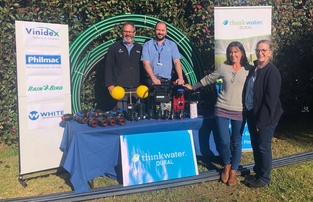 DROUGHT SUPPORT: Bruce Robinson, Mark Robertson, Lynne McAdam, Donna Davey with equipment that was donated by Thinkwater Dural to clear the soak. Photo: SUPPLIED