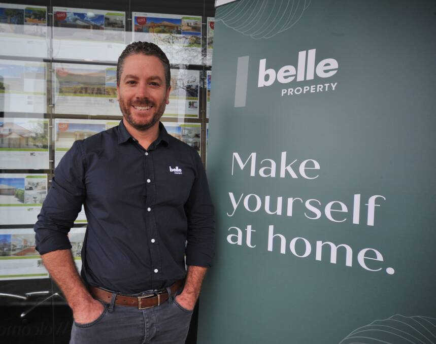 NAME CHANGE: Peter McCormack with the agency's Belle Property logo. Photo: JUDE KEOGH 