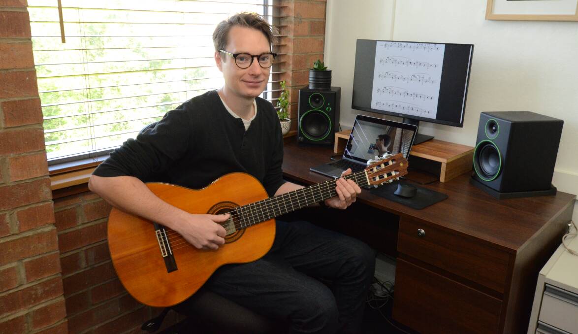 REMOTE LEARNING: Orange Regional Conservatorium guitar department head James Buchanan is conducting music lessons online. Photo: JUDE KEOGH