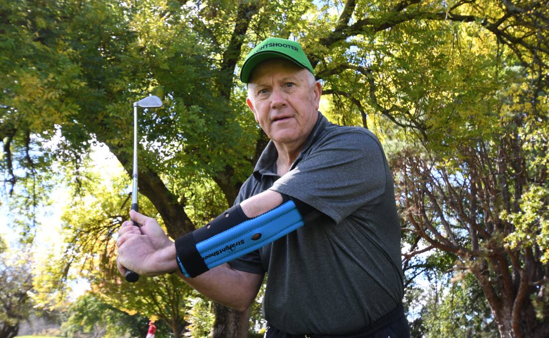 INNOVATION: Mike Middleton with his StraightShooter that he's launching in Orange on Tuesday to help sports people such as golfers with their swing technique. Photo: CARLA FREEDMAN