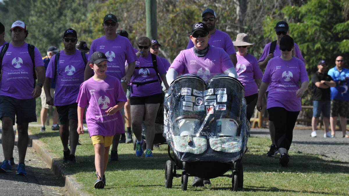 LEG ONE: Paddy Penberthy-Neil (left) accompanies Glenn Atkinson at the start of his monster walk from Orange to Sydney for charity. Photo: NICK McGRATH