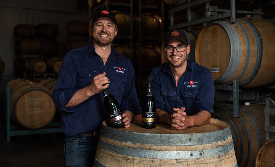 INNOVATION: Dave and Ed Swift from Printhie Wines with the sparkling wine they will be using for the virtual tasting on Friday. Photo: SUPPLIED
