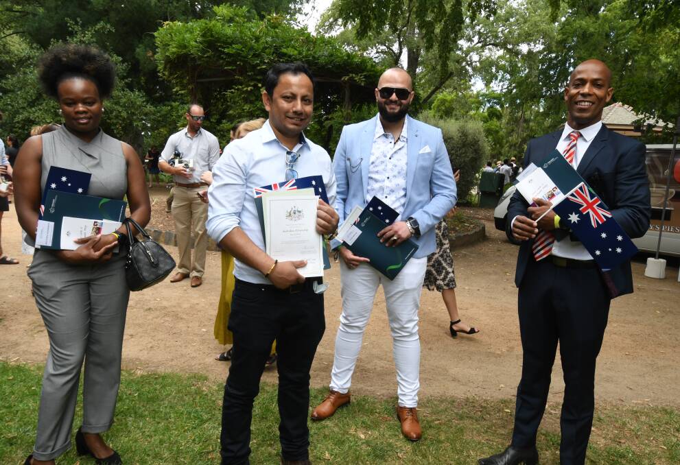 NEW CITIZENS: Portia Makurumure, Bjay Kunwar, Adam Abraham and Julio Barbosa became Australian citizens on Tuesday. Photo: JUDE KEOGH