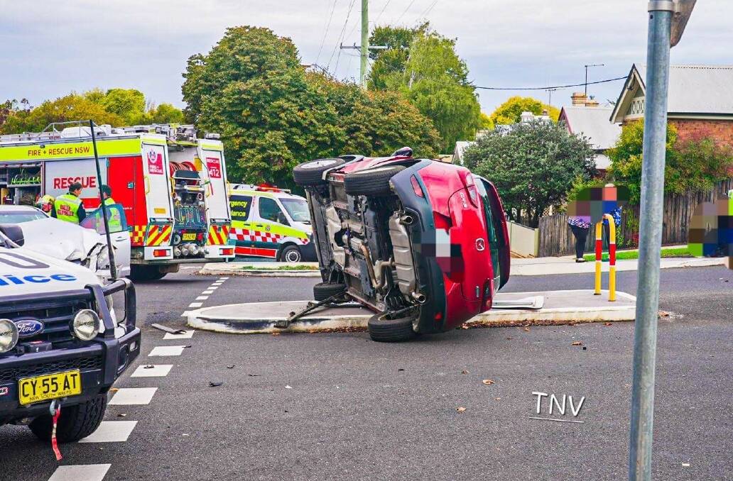 A car landed on its side following a crash at the intersection of March and Sale Streets on Monday afternoon. Picture by Troy Pearson TNV