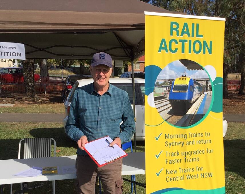 CAMPAIGN: Orange Rail Action Group member Neil Jones collecting petition signatures at recent Gnoo Blas Autofest. Photo: SUPPLIED