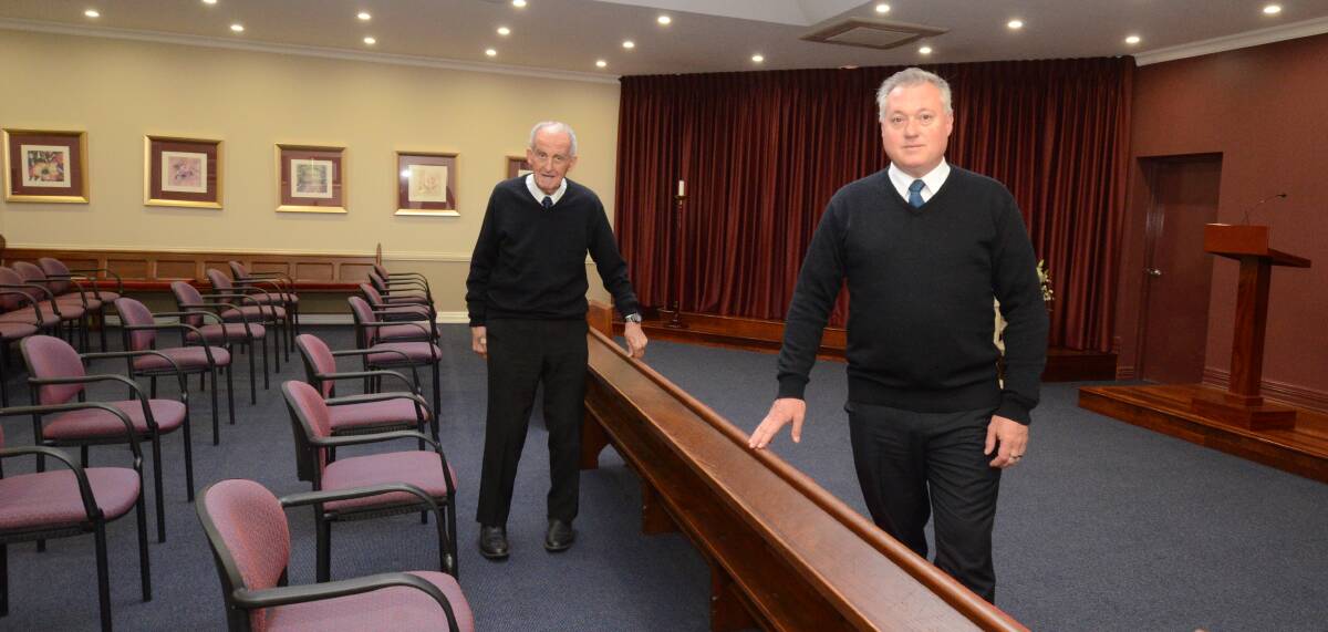 RESTRICTION: Norman Penhall and Craig Ostini are following space and numbers restrictions in the chapel at Norman J Penhall Funeral Directors. Photo: JUDE KEOGH