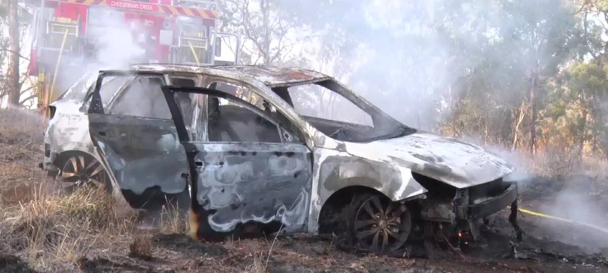 BURNT: Emergency services responded to a car fire involving a stolen Hyundai i30 on the Escort Way on Wednesday morning. Photo: TROY PEARSON/TOP NOTCH VIDEO