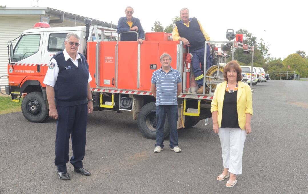 SUPPORT: Rural Fire Service Canobolas Zone manager David Hoadley, with Glen Griffith, Orange Art Society president David Mason, Harold Rossiter, and Sandra Wenban who initiated the art auction. Photo: JUDE KEOGH 