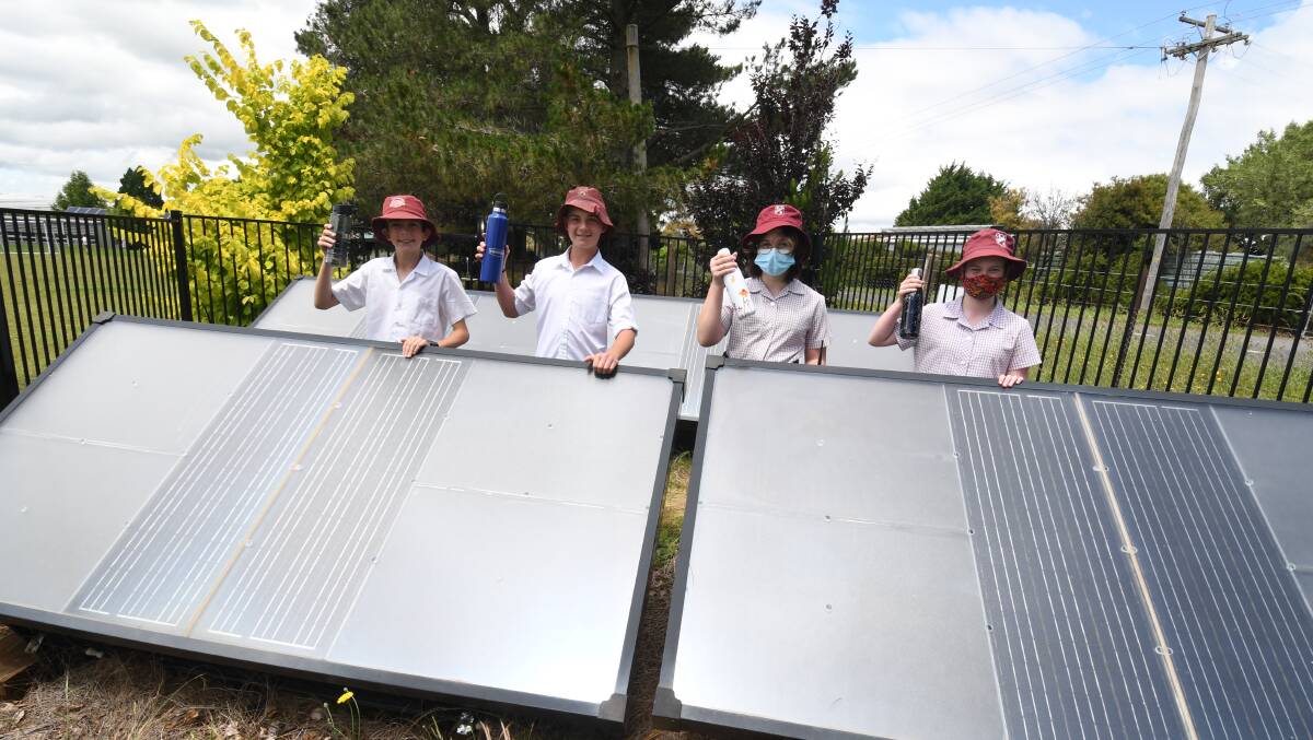 DROUGHT PROOF: Canobolas Public School students Billy Yeo, Fletcher Ferguson, Emme Caulfield and Sheridan Peter with the hydropanels. Photo: JUDE KEOGH