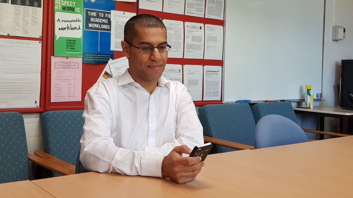PHUBBING STUDY: Charles Sturt University Associate Professor Yeslam Al-Saggaf is launching a study into why people can't get off their phones even when meeting up with friends. Photo: SUPPLIED