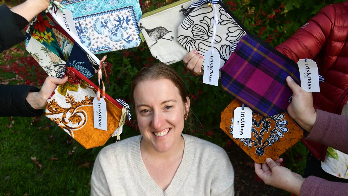 Trix and Floss owner Natalie McIvor with some of her bags at the business launch at the Orange Botanic Gardens on Saturday. Picture by Carla Freedman
