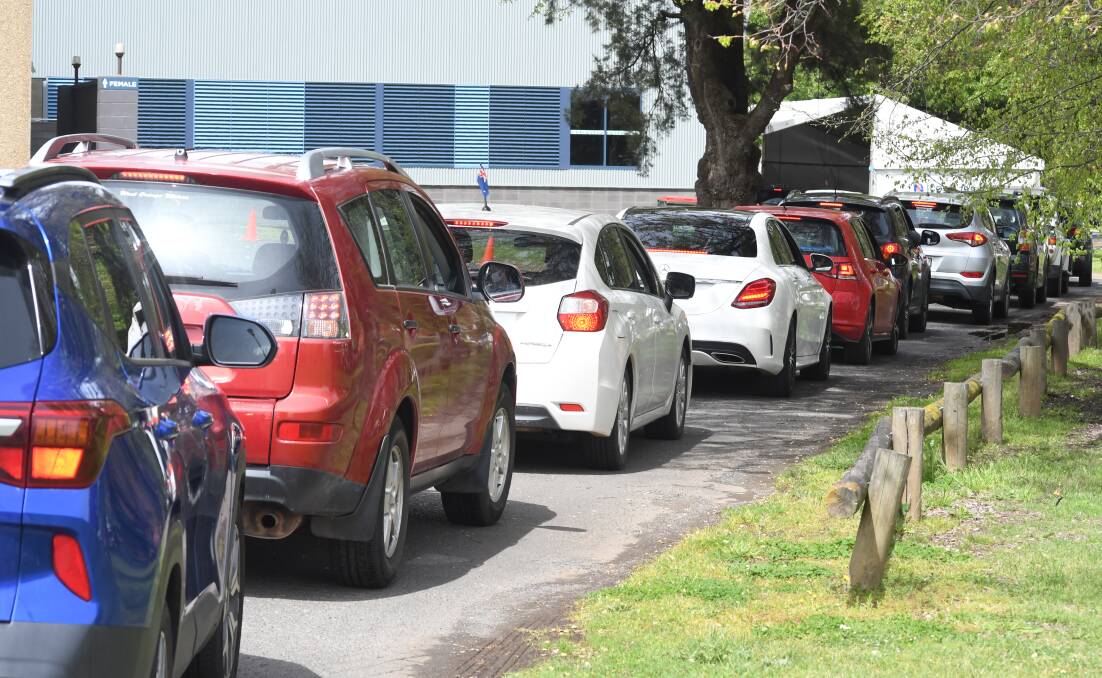TESTING LINE: Cars lined up for COVID testing on Monday. FILE PHOTO
