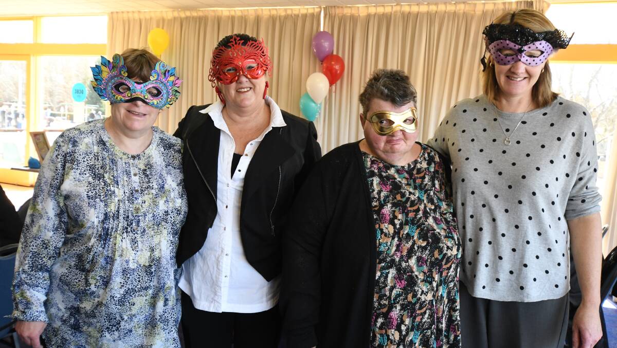 Staff, clients and carers attended a masquerade party on Thursday to commemorate the closure of the Day to Day Living program. Photo: JUDE KEOGH