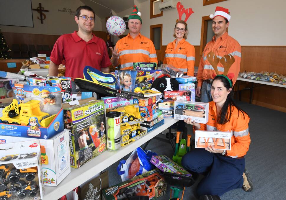 TOY DRIVE: Salvation Army Captain David Grounds with Tim Thornhill, Merrilyn Tinsley, Andrew Grivas and Alison Farrar who delivered the donation from Newcrest's Cadia Valley Operations. Photo: JUDE KEOGH