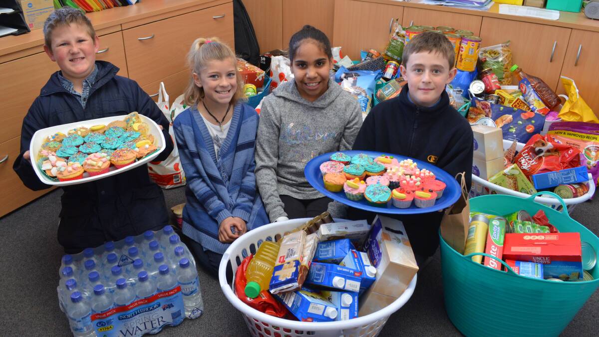 Students from Orange East Public School made gold coin donations for wearing the clothes of their choice, bought cupcakes and welcomed donated non-perishable items on Friday so they could help farmers affected by drought. Photos: TANYA MARSCHKE