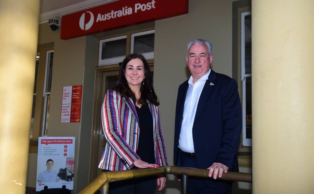 PILOT SITE: Australia Post retail executive general manager Catriona Noble and CEO Paul Graham outside Orange Post Office on Monday. Photo: CARLA FREEDMAN