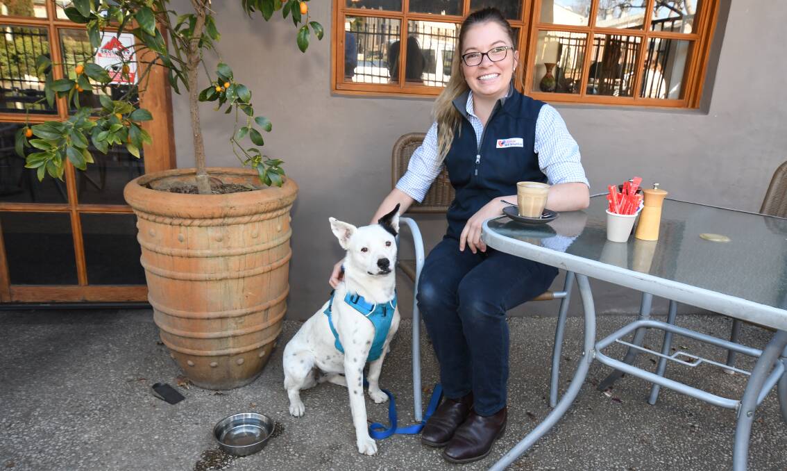 CANINES AND CAPPUCCINOS: Orange Vet Hospital veterinarian Nichala Elin with Lola at Nile Street Cafe. Photo: JUDE KEOGH
