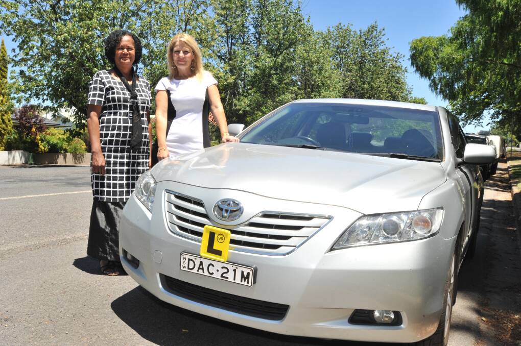 STOPPING UNLICENSED DRIVING: Learner driver and Indigenous Home Delivery Education and Training Incorporated public officer Tavenisa Diri and Orange Self-Empowerment Group secretary Koula Cathy Michael. Photo: JUDE KEOGH 0112jkdrive1