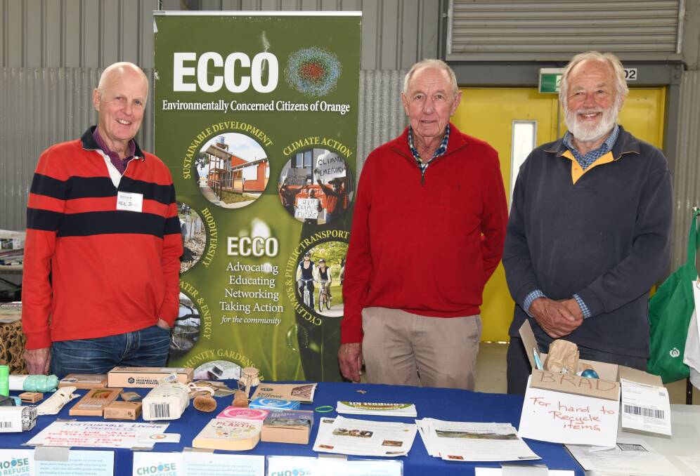 ECCO president Neil Jones, committee member Col Foster and secretary Nick King at the groups stand at the Orange Sustainable Living Week at the Naylor Pavilion on Sunday. Picture by Carla Freedman