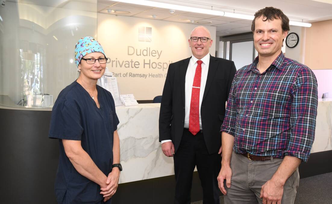 FIRST FOR THE REGION: Orthopedics clinical nurse specialist Pam Fullgrabe , Dudley CEO Paul McKenna, orthopaedic surgeon Dr Ben Milne. Photo: JUDE KEOGH