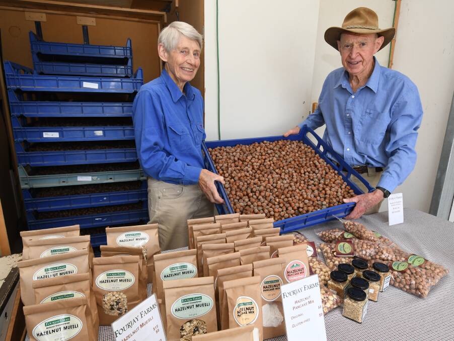 GOOD YEAR: Fourjay Farms owners Jean and Basil Baldwin with some of the hazelnuts from this year's record haul. Photo: JUDE KEOGH