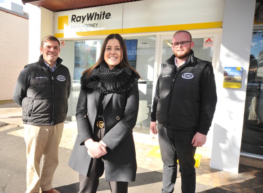 STRONG DEMAND: Peter Bromley, Emms Mooney, James Taylor at Ray White Emms Mooney in Orange are being kept busy with Orange's booming property market. Photo: JUDE KEOGH