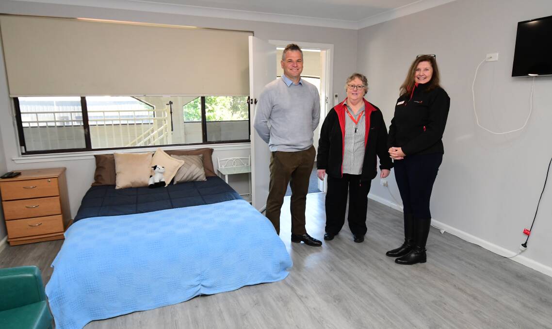HOUSING SERVICE: Member for Orange Phil Donato, Housing Plus Homelessness and Adult Housing Support Service team leader Toni Parker, and Housing Plus head of Customer Services Liz Stamatelos in a crisis accommodation room in Orange. Photo: JUDE KEOGH