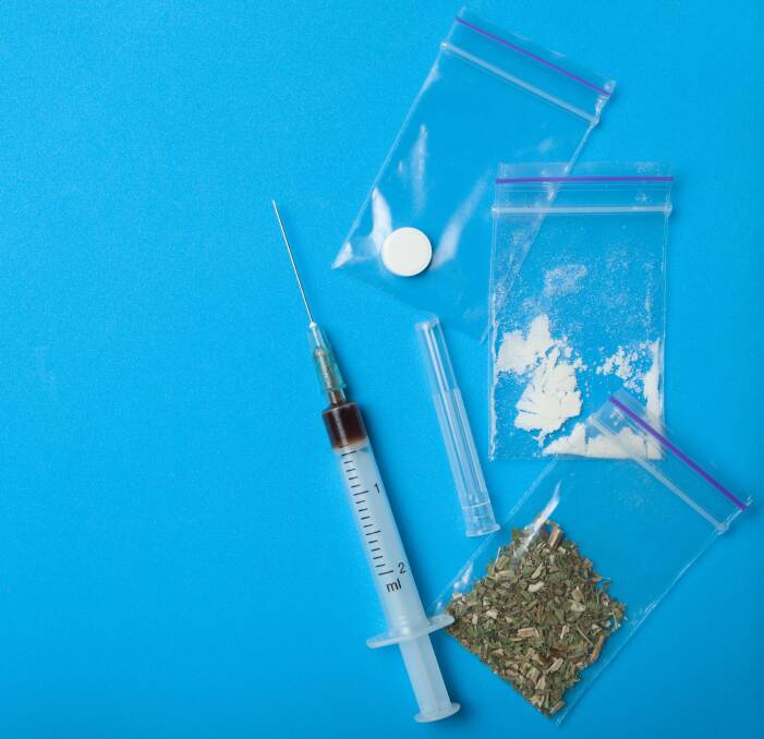 DRUG RISK: Police found prescription drugs on a table and methamphetamine and cannabis stuffed into a doorstop that had been screwed into a wall in a man's motel room. File photo: SHUTTERSTOCK