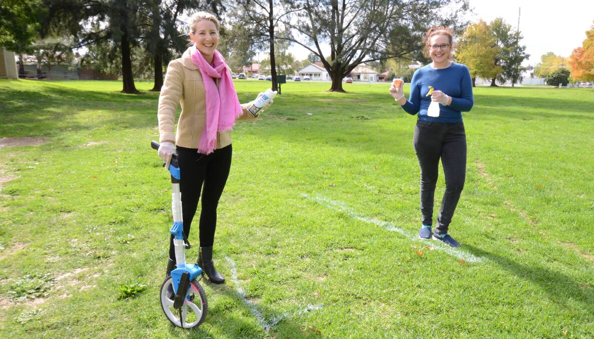 DISTANCE MEASURES: Orange Farmers Market manager Holly Manning, and SJ Pienaar from Second Mouse Cheese are spacing stalls two metres apart. Photo: JUDE KEOGH