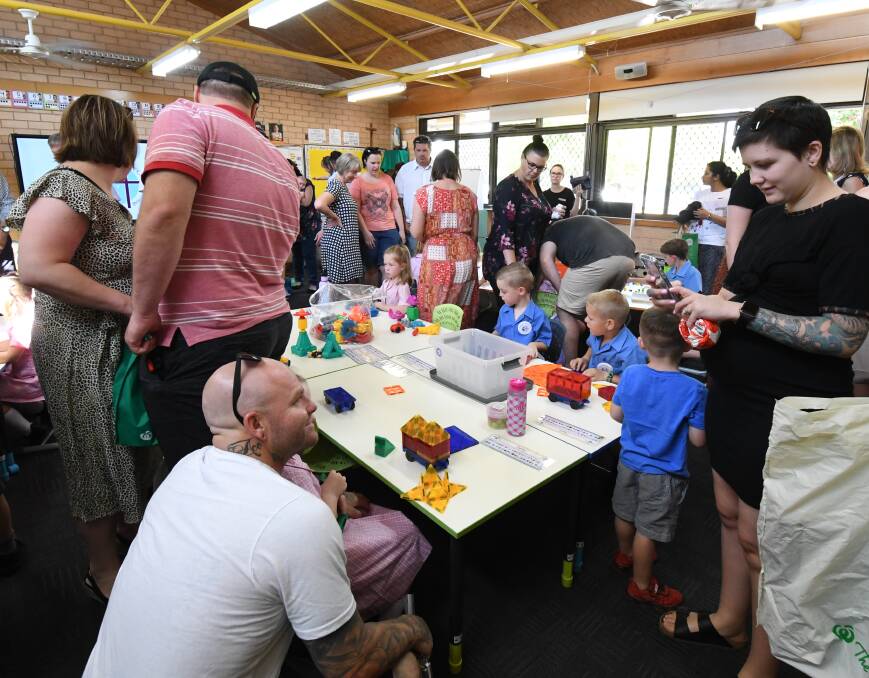 PROUD MOMENT: Parents and families helped their children settle in for their first day of kindergarten on Thursday. Photo: JUDE KEOGH