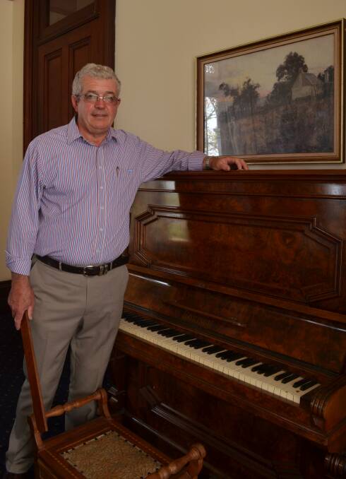 RETURNED: Duntryleague Mansion Foundation chairman John Cook is pleased a piano that was originally housed at Duntryleague has been returned. Photo: TANYA MARSCHKE