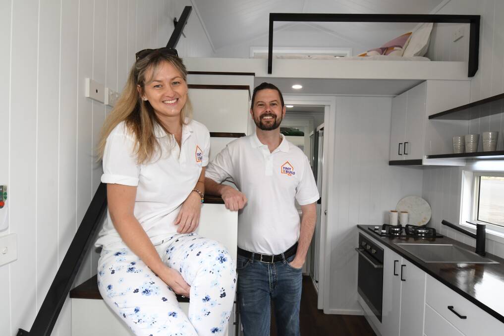 COMPACT LIVING: Tiny Build sales manager Jen Westbrook and Rob Jensen inside one of the tiny houses at the Rotary Family Market Day on Sunday. Photo: CARLA FREEDMAN 