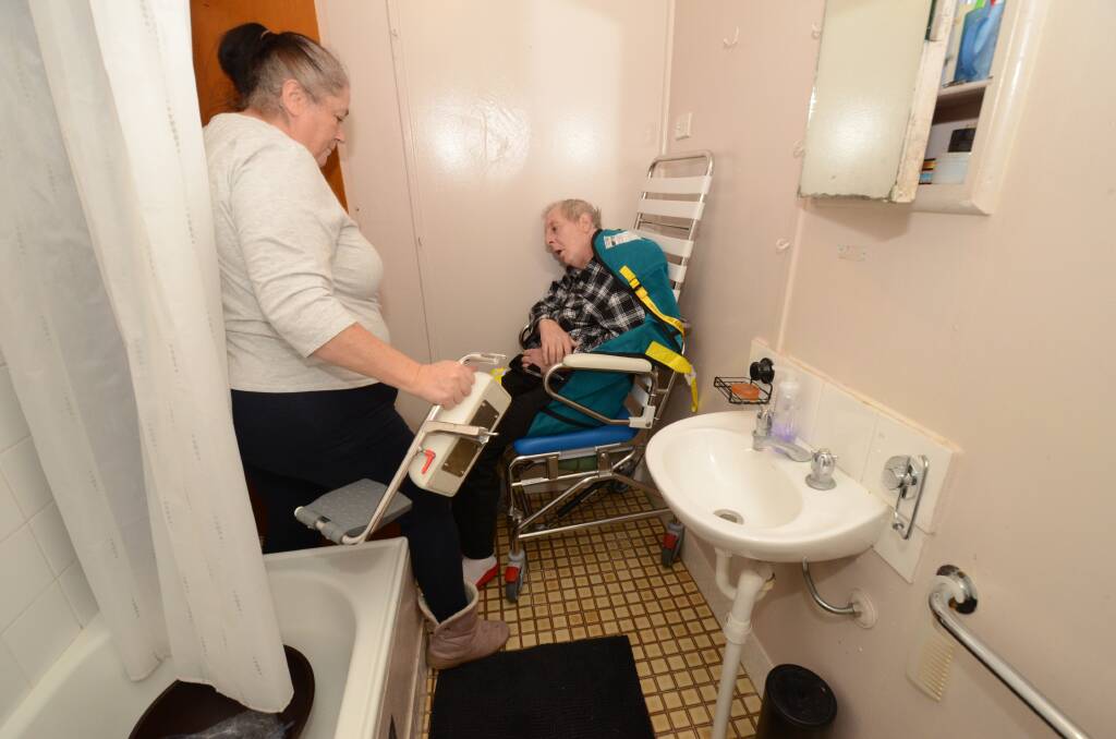 CHANGE NEEDED: Rosemary and Michael Davis find it difficult to help him shower in the small bathroom. Photo: JUDE KEOGH