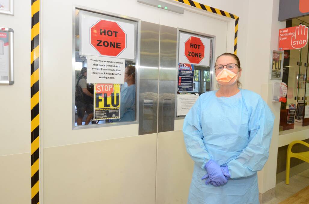 TEST CENTRE: Enrolled nurse Alison Lyden covers up to protect herself at Orange hospital where people can be tested for COVID-19. Photo: JUDE KEOGH