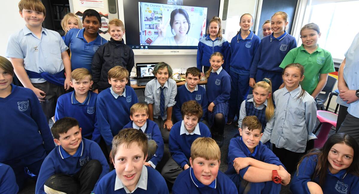 GLOBAL LANGUAGE CONNECTION: Students from 6A at Bletchington Public School have been learning Chinese direct from China from teacher Sarina. Photo: JUDE KEOGH