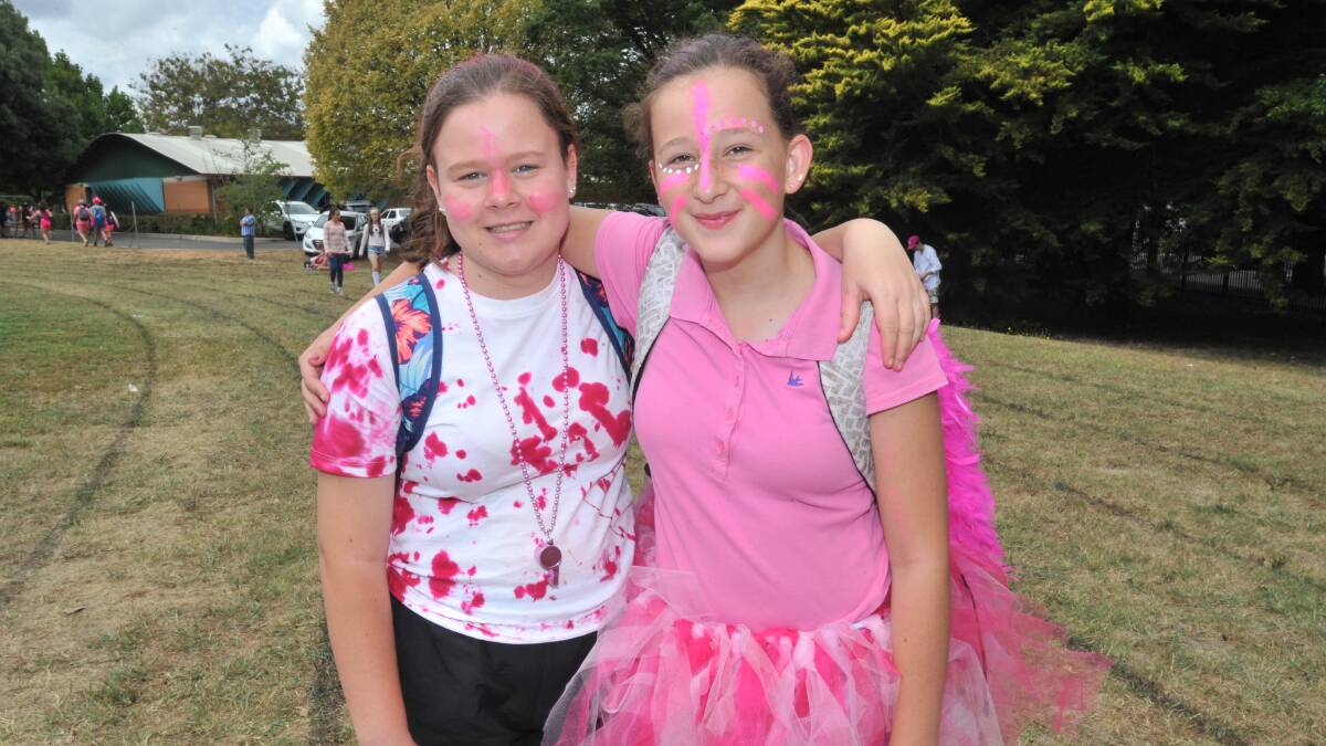 STRENGTH IN NUMBERS: Orange High School students Summer Mosley and Keely Angus were among the students who dressed up in pink to support the McGrath Foundation. Photos: JUDE KEOGH 0301jkpink4