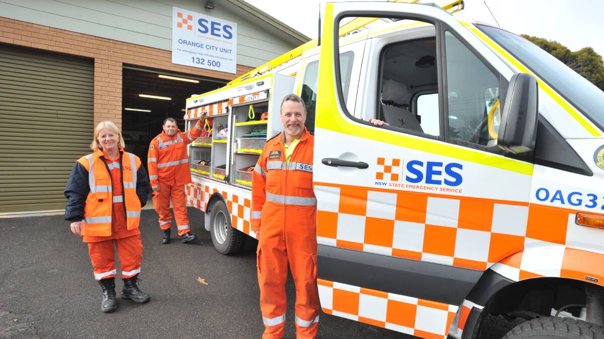 NEW AND IMPROVED: SES crew members Peter Hodgins, Wendy Butterfield and Grant Hill inspect the new light storm vehicle. Photo: JUDE KEOGH 0615jkses1