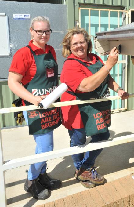AS GOOD AS NEW: Bunnings Warehouse Orange team members Isabelle Treacy and Linda Williamson painted the Orange Kart Racing Club premises on Tuesday.