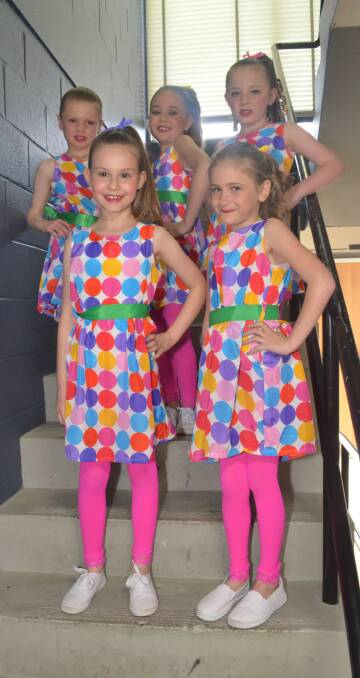 COLOURFUL COSTUMES: Kaliah Conning, Imogen Priest, Dolci Layton, Ava King and Kaitlyn Swain wore matching dresses and ribbons for their performance.