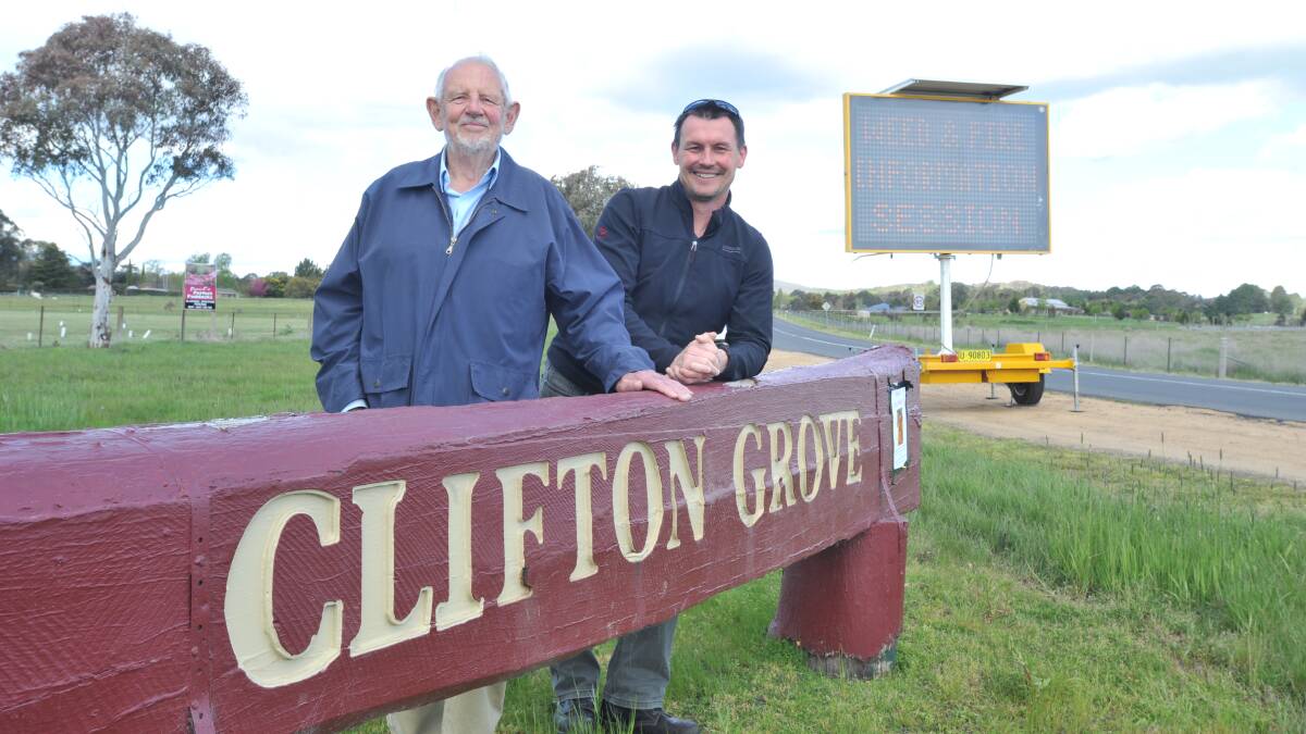 TOUGH TASK: Clifton Grove Residents Working Group members Charlie Everett and Peter West aim to tackle problem weeds. PHOTO: JUDE KEOGH
