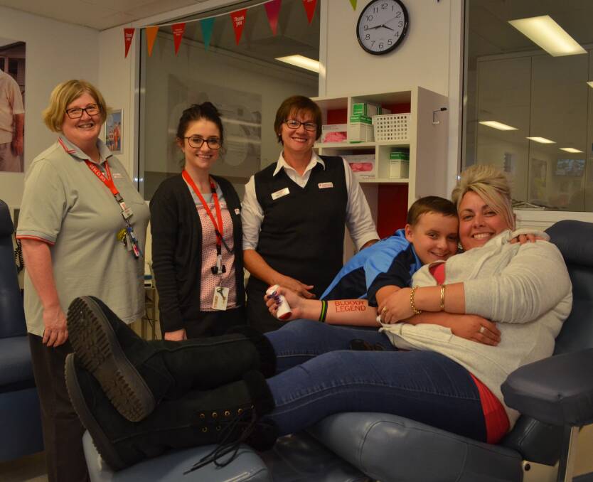 BLEED BY EXAMPLE: Donor centre nurses Kristine Lindsay and Emma Moore, and centre manager Gail Turnbull with Josh and Alison Johansen. Photo: EMILY BENNETT