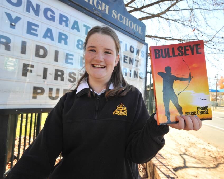 OFF TO A FLYING START: Orange High School student Bridie Pickering is targeting a career as a writer after completing her first novel in two months. Miss Pickering's book is now available online. Photo: JUDE KEOGH 0613jkbook1