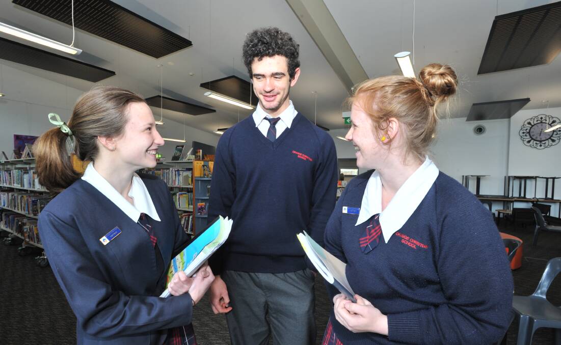 BY THE BOOK: Orange Christian School students Emily Pierce, Jesse Richardson and Amber Kent had no surprises in Tuesday's CAFS exam. Photo: JUDE KEOGH