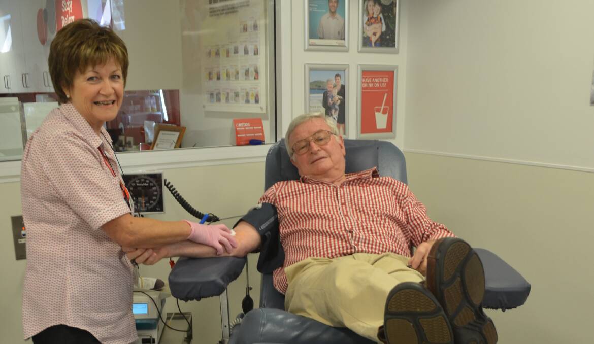 EVERYDAY HERO: Registered nurse Kez McCarthy with regular blood donor Robert Bruce at the Orange Donor Centre. Photo: EMILY BENNETT