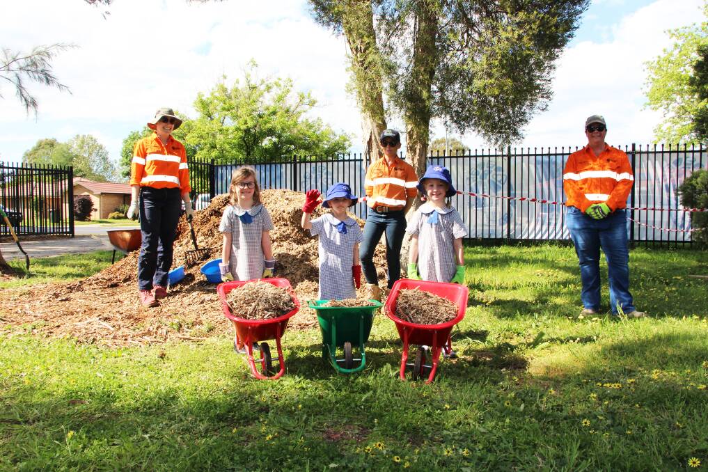 NEW GARDEN: Cadia's Kendra Campbell, Teiya Thornberry and Kara Hatch with students Phoebe Ryan, Amelia Maggs and Sophia Johnson. Photo: SUPPLIED.