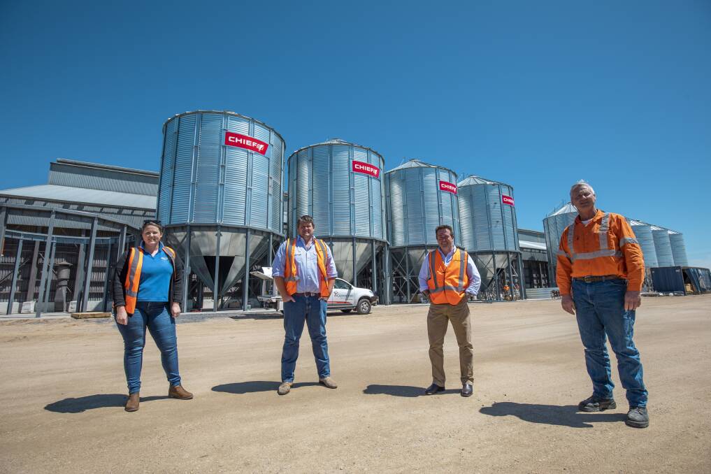 BUMPER: Grainforce's Estelle Larnach, Wes Larnach and Derek Larnach with MP Paul Toole (second from right) at the new silos at the Kelso terminal. Photo: SUPPLIED.