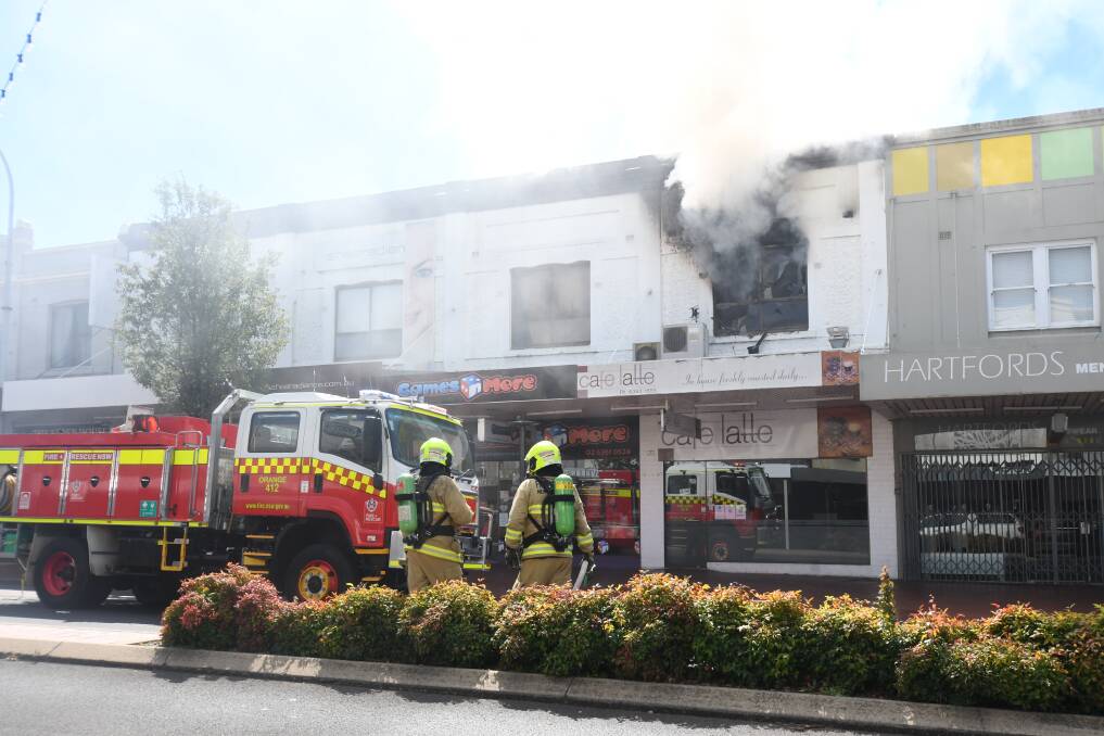 COLLAPSE: Fire and Rescue on the scene at the fire in an apartment above Cafe Latte on April 5. Photo: CARLA FREEDMAN. 